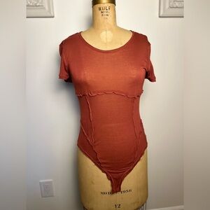 Free People women’s short sleeve body suit large rose color